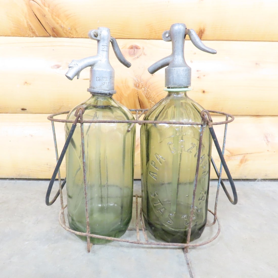 Vintage Romanian Apa Gazoasa Seltzer Bottles: Vintage Romanian Apa Gazoasa Seltzer Bottles - Apa Gazoasa Stas 392-52 & Turda stamped Seltzer Bottles. Decorative Finial on Turda spout has broken off. Coms with Metal Tote. Lot Size: 12 x 10 x 6", 9