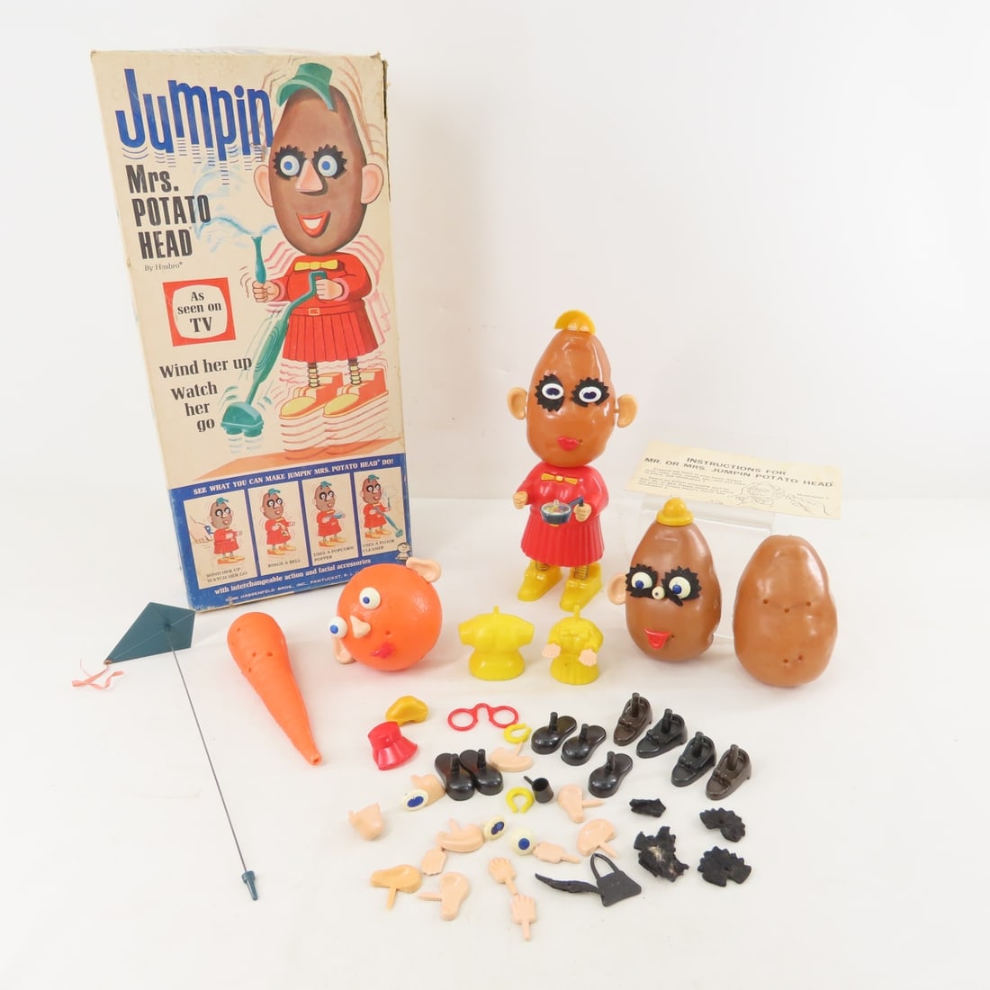 1960's Jumpin' Mrs Potato Head & More- works: 1960's Jumpin' Mrs Potato Head & More- works - Jumpin' Mrs potato head works- has popcorn pan and some other accessories as shown in original box (has some damage). Also 2 plain potato heads, orange