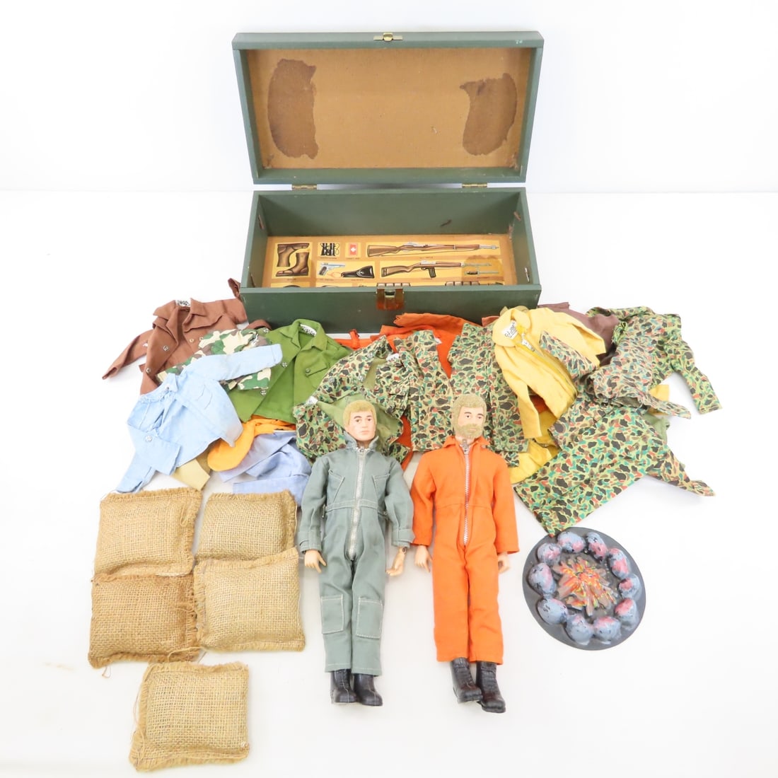 2 GI Joe Figures & Trunk with Hong Kong Clothes: 2 GI Joe Figures & Trunk with Hong Kong Clothes - plus campfire and sand bags, 25+ pieces of clothing in trunk, all with Honk Kong tags. Lot Size 14x14x14" 5 LB All information and photos are