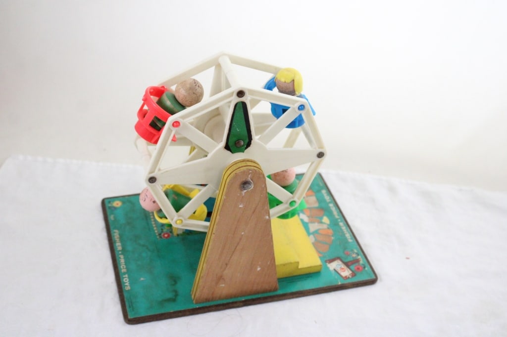 1966 Fisher Price Ferris Wheel #969 with People: 1966 Fisher Price Ferris Wheel #969 with People - Works, 9" x 9" x 7". 2 Lbs. All information and photos are intended to be as accurate as possible, but errors are possible. No item may be