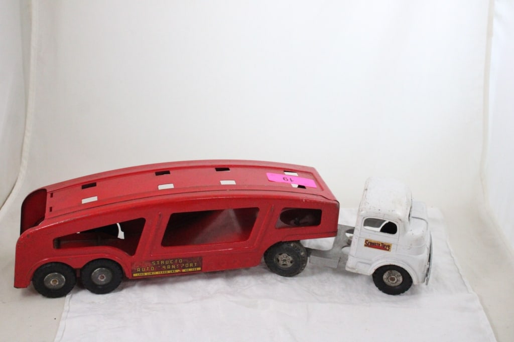 Structo Pressed Steel Car Carrier Hauler: Structo Pressed Steel Car Carrier Hauler - 22" x 5" x 5". 3 Lbs. All information and photos are intended to be as accurate as possible, but errors are possible. No item may be returned or re