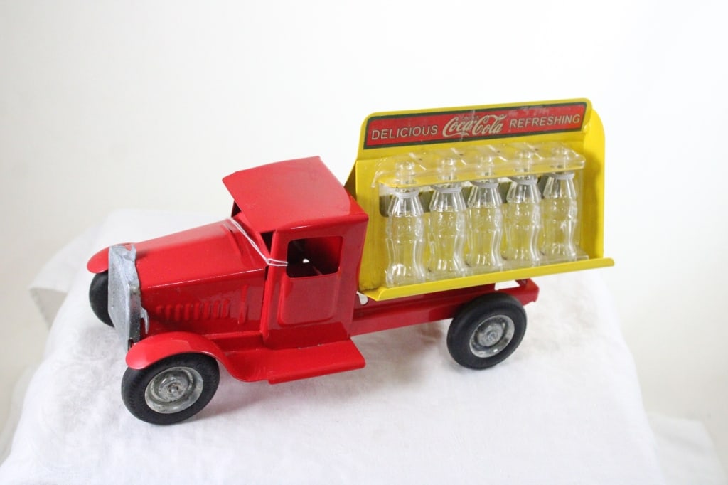 Metal Craft Coca Cola Truck with Bottles: Metal Craft Coca Cola Truck with Bottles - Gear Box Pressed Steel. 11" x 4" x 7". 2 Lbs. All information and photos are intended to be as accurate as possible, but errors are possible. No item