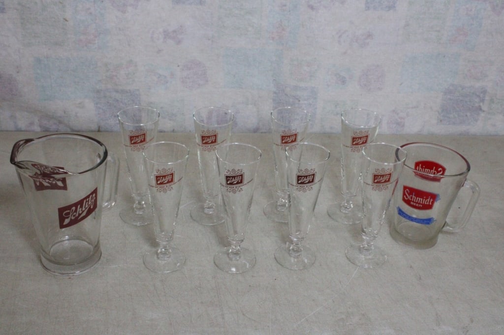 Schlitz & Schmidt Beer Pitchers & Pilsner Glasses: Schlitz & Schmidt Beer Pitchers & Pilsner Glasses - Schlitz Beer Pitcher, Schmidt Beer Pitcher, 8 Schlitz Pilsner Pedestal Glasses. Lot Size 14.5" x 14.5" x 10.5". 13 Lbs. All information and