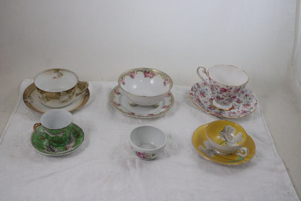 4 Teacups, 1 Demitasse Dragon Cup, Saucers, Sugar: 4 Teacups, 1 Demitasse Dragon Cup, Saucers, Sugar - Makers are Occupied Japan, R.S. Germany, Regina Germany, Royal standard Chintz Roses. Lot Size 8" x 8" x 4.5". 3 Lbs. All information and