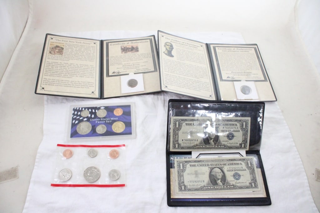 1996D Mint Set, 2005S Proof Set & More: 1996D Mint Set, 2005S Proof Set & More - 2 $1 Silver Certificates 1957, Coin of Emperor Aurelion with COA, 1737 U.S. New York Penny with COA. Lot Size 8" x 6" x 2". 1 Lb. All information and