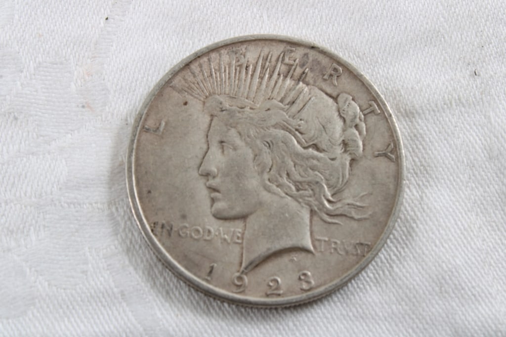 1923 S Peace Silver Dollar: 1923 S Peace Silver Dollar - Lot Size 3" x 3" x 1". .5 Lb. All information and photos are intended to be as accurate as possible, but errors are possible. No item may be returned or refused