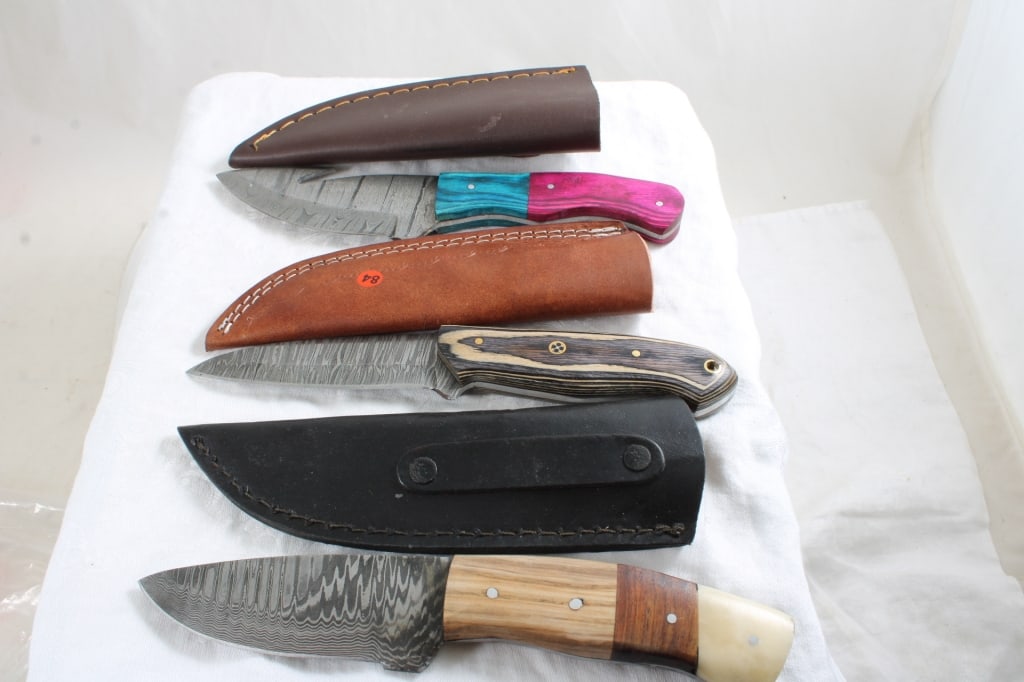 3 Damascus Custom Made Knives in Sheaths: 3 Damascus Custom Made Knives in Sheaths - Lot Size 10" x 5" x 3". 2 Lbs. All information and photos are intended to be as accurate as possible, but errors are possible. No item may be