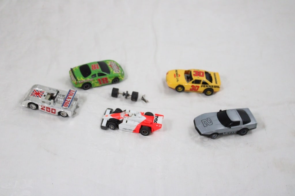 5 Tyco Slot Cars LOLA260, Corvette, JAMCAR500: 5 Tyco Slot Cars LOLA260, Corvette, JAMCAR500 - 3 Tested and working and 2 others. Lot Size 4" x 4" x 3". 1 Lbs. All information and photos are intended to be as accurate as possible, but errors