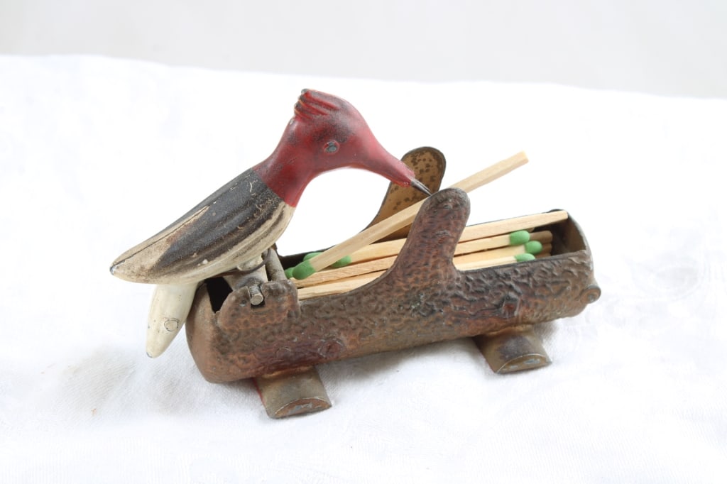 1950's Cast Metal Woodpecker Toothpick Dispenser: 1950's Cast Metal Woodpecker Toothpick Dispenser - Lot Size 4.5" x 3" x 2". .5 Lb. All information and photos are intended to be as accurate as possible, but errors are possible. No item