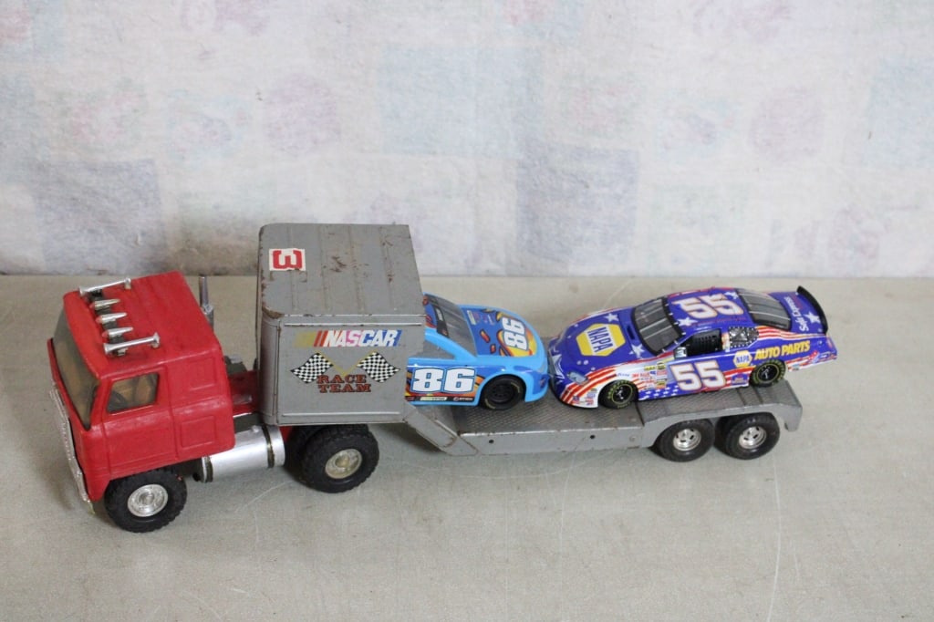 Ertl Pressed Steel Nascar Car Hauler & Race Cars: Ertl Pressed Steel Nascar Car Hauler & Race Cars - Lot Size 12" x 6" x 5". 5 Lbs. All information and photos are intended to be as accurate as possible, but errors are possible. No item