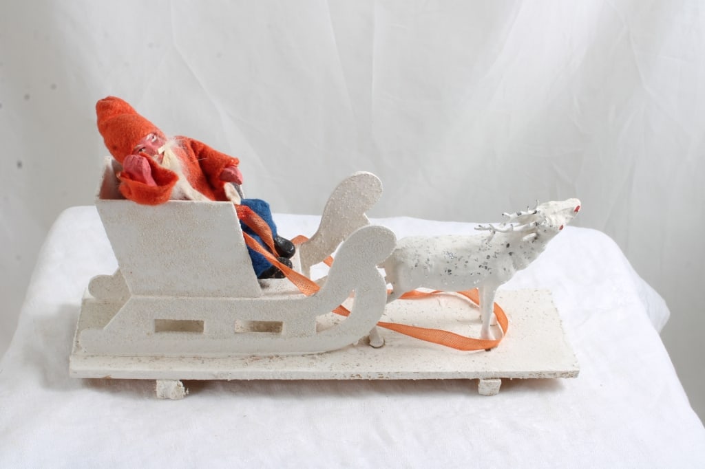 German Belsnickel Paper Mache Santa in Sleigh: German Belsnickel Paper Mache Santa in Sleigh - Santa with Sleigh and Reindeer in Original Box marked Germany on the Bottom. Measures 9.5" long. Lot Size 9.5' x 4" x 3". 1 Lbs. All information