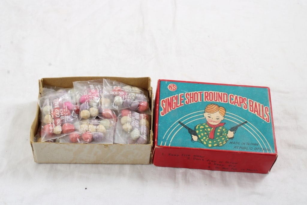 Single Shot Round Cap Balls NEW OLD STOCK: Single Shot Round Cap Balls NEW OLD STOCK - 20 plus packs in box. Lot Size 5" x 3" x 2". .5 Lbs. All information and photos are intended to be as accurate as possible, but errors are possible.