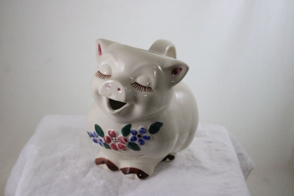 Shawnee Smiley Pig Milk Pitcher with Pink Flowers: Shawnee Smiley Pig Milk Pitcher with Pink Flowers - Lot Size 8.5" x 8" x 6". 3 Lbs. All information and photos are intended to be as accurate as possible, but errors are possible. No item