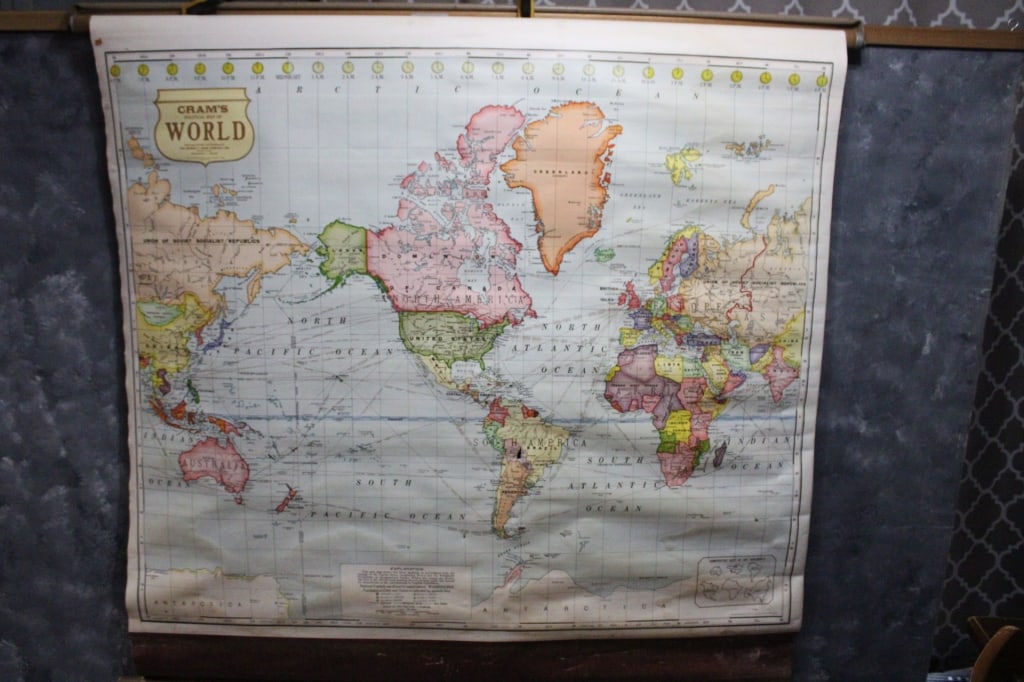 1930's School Pull Down World Map by George Cram: 1930's School Pull Down World Map by George Cram - C1054. One small hole in S. America Section. Map measures 50.5" x 48". Lot Size 55" x 3" x 3". 5 Lbs. All information and photos are intended