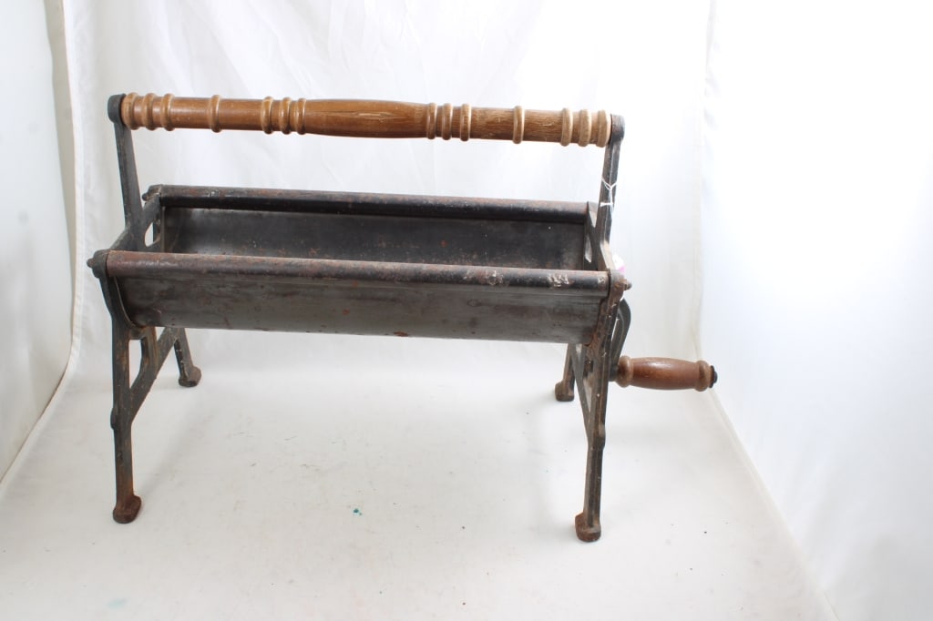 Cast Iron Newspaper Log Roller with Wood Handle: Cast Iron Newspaper Log Roller with Wood Handle - Lot Size 23" x 15" x 8". 11 Lbs. All information and photos are intended to be as accurate as possible, but errors are possible. No item