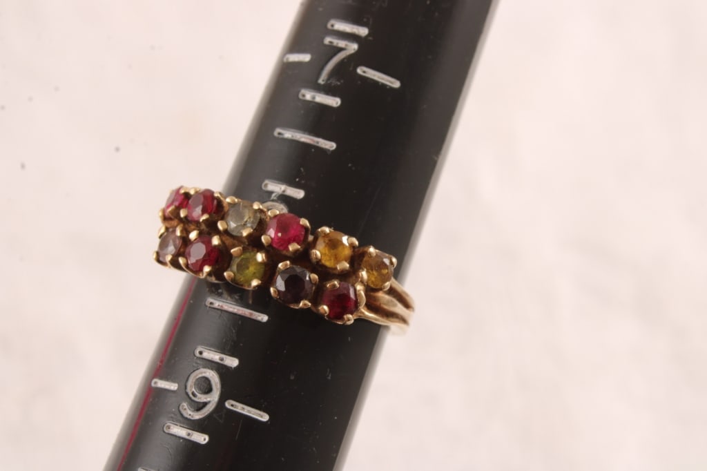 10k Gold Mother's Ring with 11 Stones 4.4 Grams: 10k Gold Mother's Ring with 11 Stones 4.4 Grams - Lot Size 3" x 2" x 1". .5 Lb. All information and photos are intended to be as accurate as possible, but errors are possible. No item may be