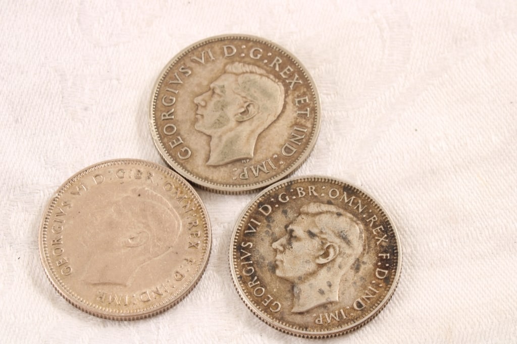 3 Foreign Silver Coins: 3 Foreign Silver Coins - 1944 and 1943 Australia Florin Silver Coins 92.5 Silver, 1918 Canadian 50 Cent Silver Coin George VI 92.5 Silver. Lot Size 3" x 3" x 1". .5 Lb. All information and photos