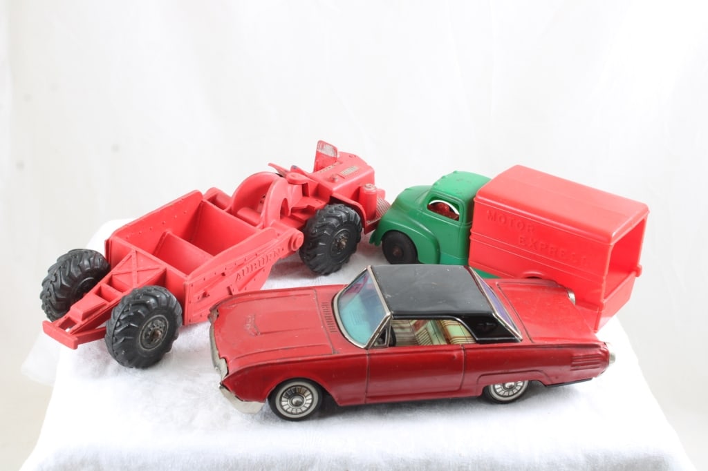 Bandai, Hubley & Auburn Vintage Toys: Bandai, Hubley & Auburn Vintage Toys - Bandai Japan Ford Thunderbird Tin Friction Works (missing one hubcap), Hubley Kiddie Toy Motor Express Plastic Truck, Auburn Rubber Farm Implement Toys. Lot Size