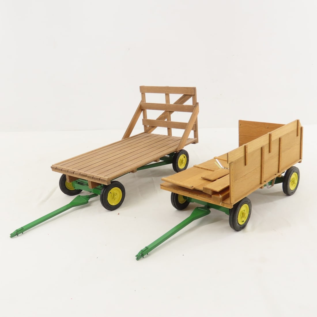 2 Scratch Built John Deere Wagons: 2 Scratch Built John Deere Wagons - scratch built hay wagon (unknown maker), scratch built chuck wagon (unknown maker)- damaged. LOT SIZE: 12x10x7", 2 LBS All information and photos are intended to