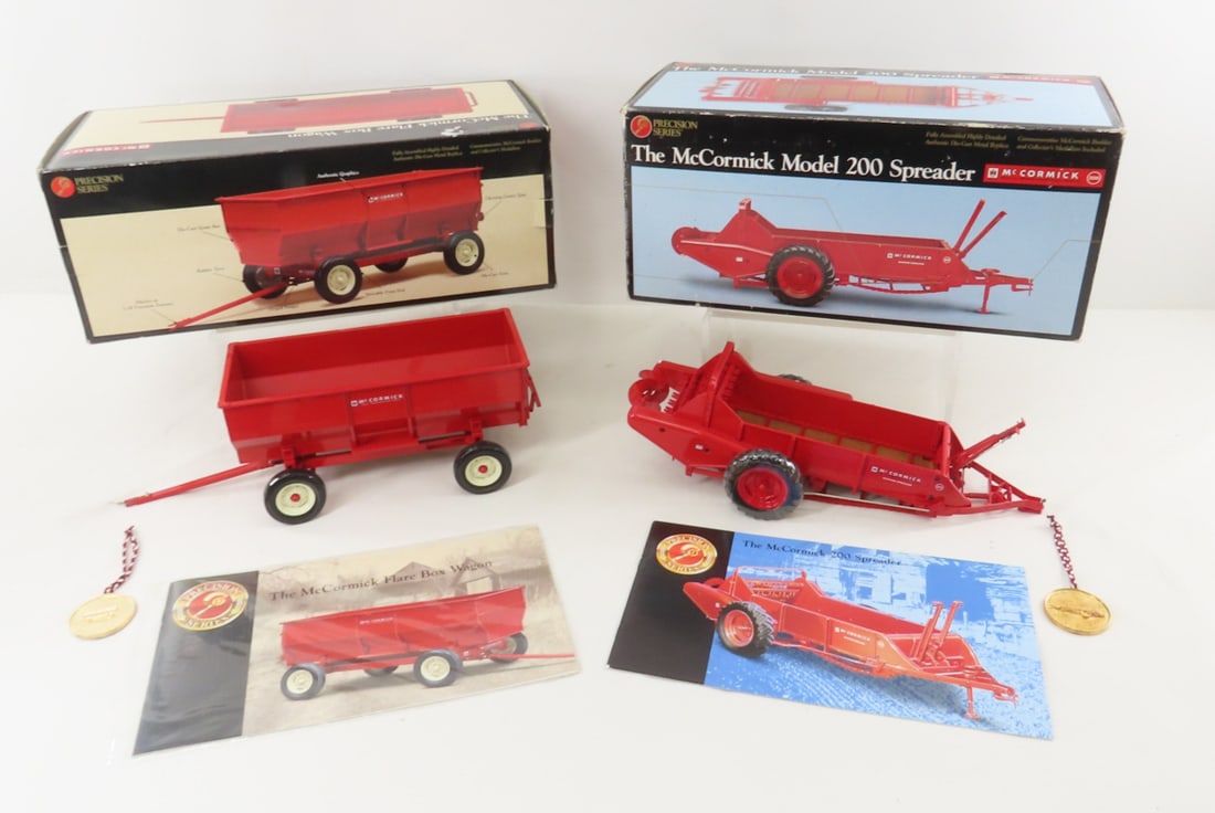 ERTL Precision McCormick 200 Spreader & Box Wagon: ERTL Precision McCormick 200 Spreader & Box Wagon - 1/16 Scale ERTL Diecast McCormick Model 200 Spreader & Flare Box Wagon in Boxes with Collector's Medallions. Open Boxes. Lot Size: 14x11x7", 5 lbs