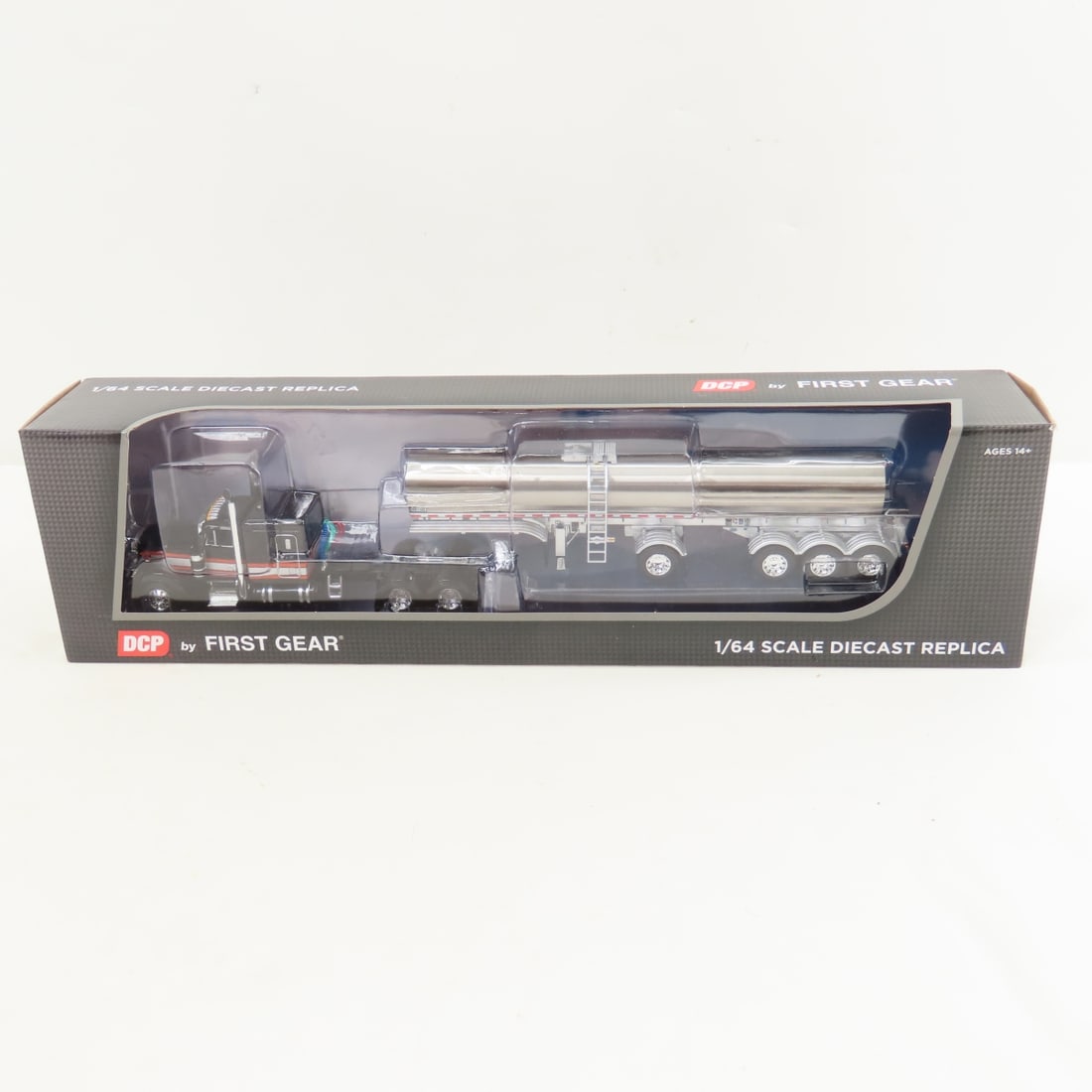 DCP First Gear 1:64 Scale Peterbilt 379 Tanker: DCP First Gear 1:64 Scale Peterbilt 379 Tanker - GF Black/Gray 60-1780, 1/64 Scale Peterbilt 379 63" Flat Top Sleeper and Walker Food Grade Quad Axle Tanker Trailer. Lot Size: 16x4x3" 1 lb All informa