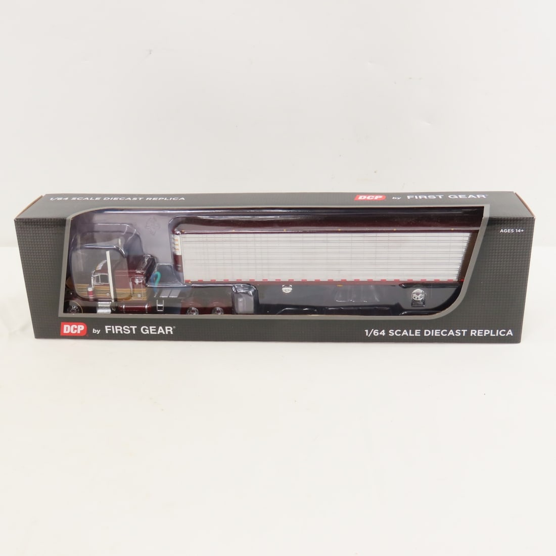 DCP First Gear 1:64 Scale Peterbilt 379 Sleeper: DCP First Gear 1:64 Scale Peterbilt 379 Sleeper - Red/Chrome 60-1729 1/64 Scale Peterbilt 379 63" Flat Top Sleeper with Utility 53' Refrigerated Ribbed Sided Spread Axle Trailer. Lot Size: 16x4x3" 1