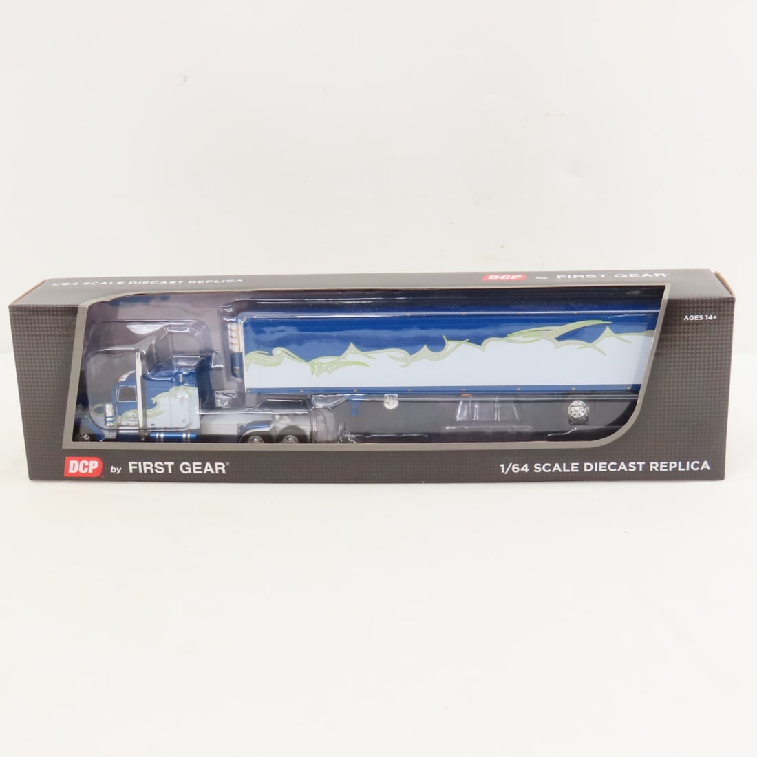 DCP First Gear 1:64 Scale Peterbilt 389 Trailer: DCP First Gear 1:64 Scale Peterbilt 389 Trailer - DD Blue/Blue 60-1457 1/64 Scale Peterbilt Model 389 with 63" Mid Roof Sleeper & Utility Ribbed Spread Axle Refrigerated Trailer. Lot Size: 16x4x3" 1