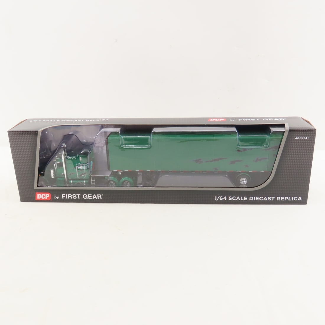 DCP First Gear 1:64 Scale Peterbilt 359 Sleeper: DCP First Gear 1:64 Scale Peterbilt 359 Sleeper - Green/Black 60-1607 1/64 Scale Peterbilt 359 63" Mid Roof Sleeper with Utility Roll Tarp Spread Axle Trailer. Lot Size: 16x4x3" 1 lb All information a