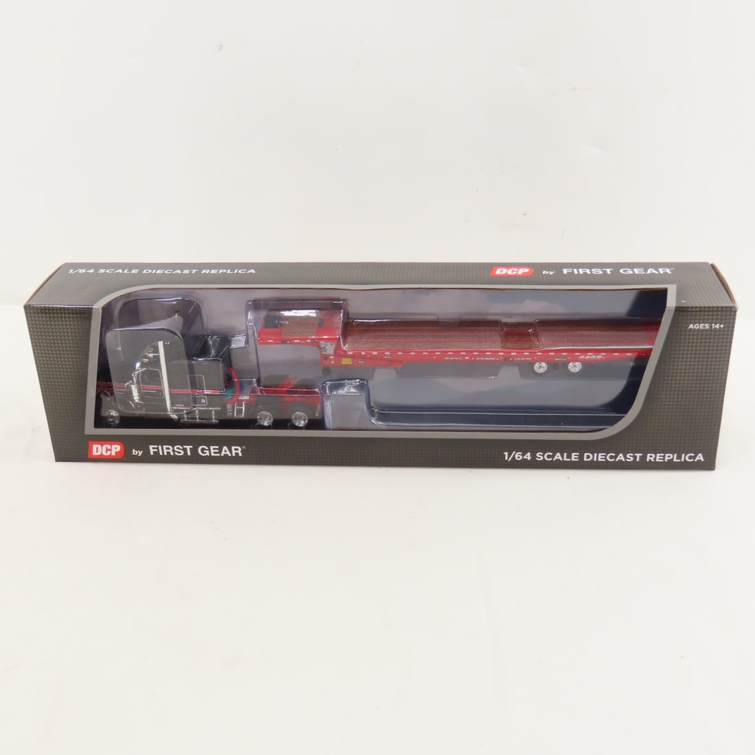 DCP First Gear 1:64 Scale Kenworth W900L Aerocab: DCP First Gear 1:64 Scale Kenworth W900L Aerocab - Black/Viper Red 60-2035 1/64 Scale Kenworth W900L w/72" Aerocab Flattop Sleeper Bunk & Landoll 440B-50CA Traveling Axle Trailer. Lot Size: 16x4x3",