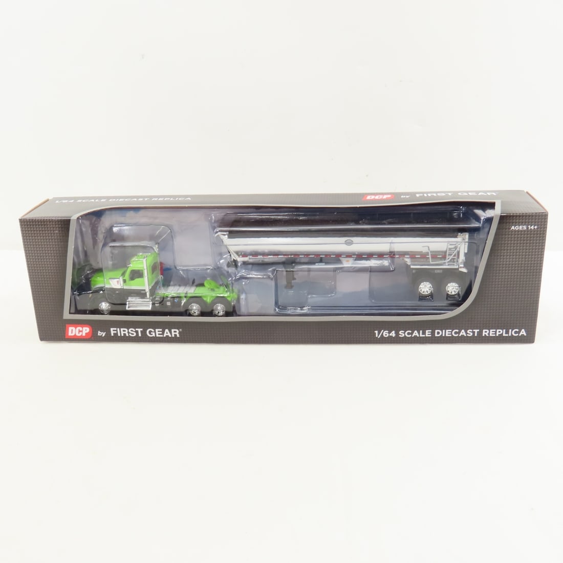 DCP First Gear 1:64 Scale Kenworth W990 Day Cab: DCP First Gear 1:64 Scale Kenworth W990 Day Cab - Lime Green/Black 60-1660 1/64 Scale Kenworth W990 Day Cab and MAC Half Round Tandem Axle Trailer. Lot Size: 16x4x3" 1 lb All information and photos ar