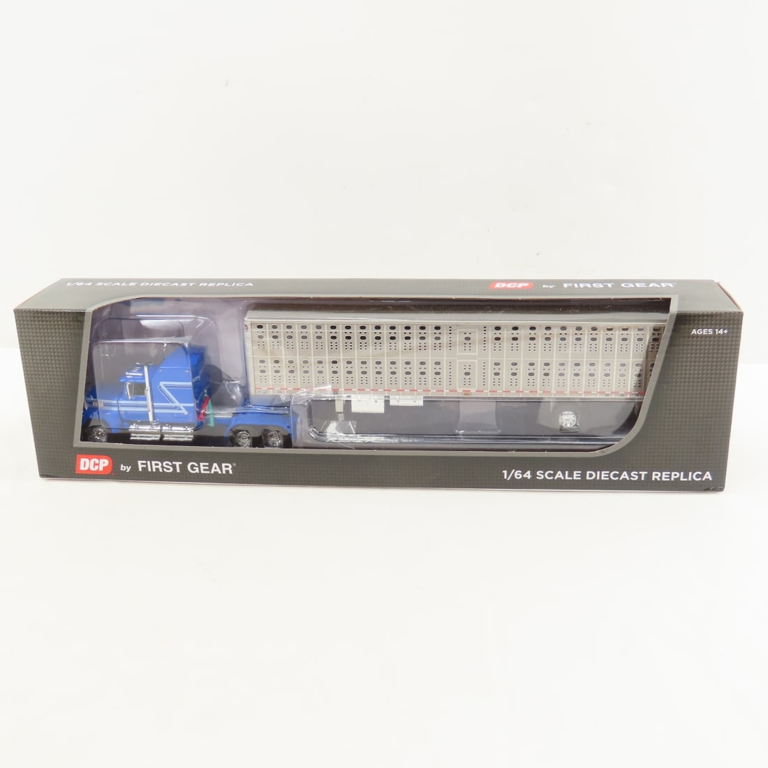 DCP First Gear 1:64 Scale Ford LTL-9000 Aerodyne: DCP First Gear 1:64 Scale Ford LTL-9000 Aerodyne - Blue/Silver 60-1769 1/64 Scale Ford LTL-9000 60" Aerodyne Sleeper with Wilson PSAL Stockmaster Spread Axle Livestock Trailer. Lot Size: 16x4x3" 1 lb
