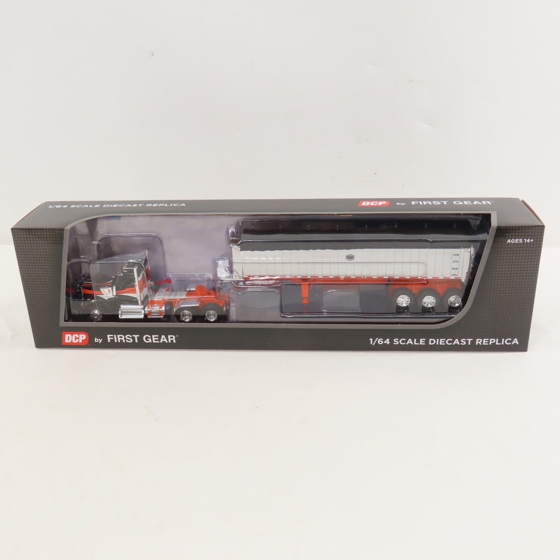 DCP First Gear 1:64 Scale Kenworth W990 Day Cab: DCP First Gear 1:64 Scale Kenworth W990 Day Cab - Black/Orange 60-2008 1/64 Scale Kenworth W990 Day Cab with MAC Coal End Dump Tri-Axle Trailer. Lot Size: 16x4x3" 1 lb All information and photos are i