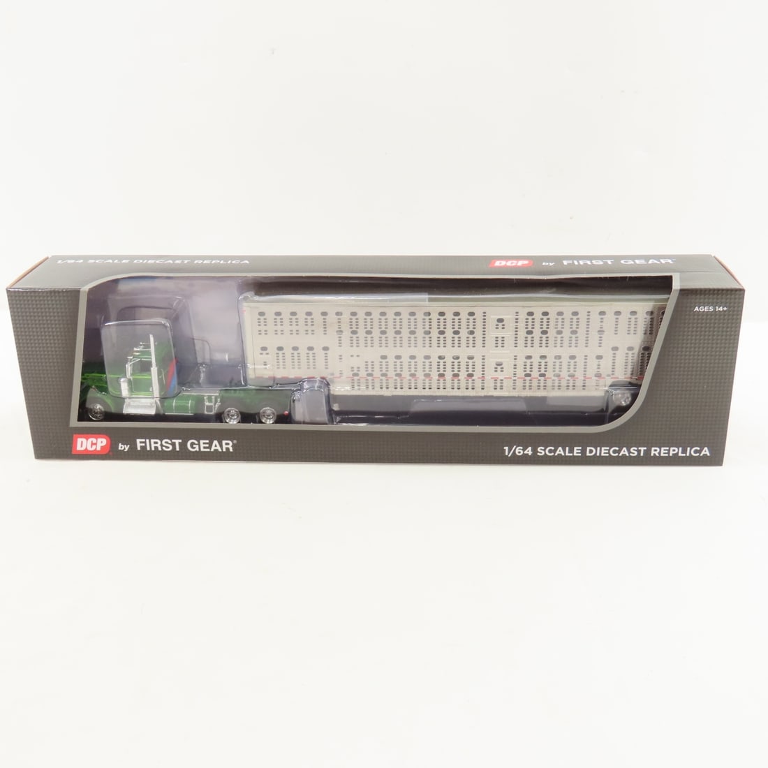 DCP First Gear 1:64 Scale Kenworth W900A Day Cab: DCP First Gear 1:64 Scale Kenworth W900A Day Cab - Neon/Dark Green 60-1263 1/64 Scale Kenworth W900A Day Cab with Wilson Silver Star Livestock Tandem Axle Trailer. Lot Size: 16x4x3" 1 lb All