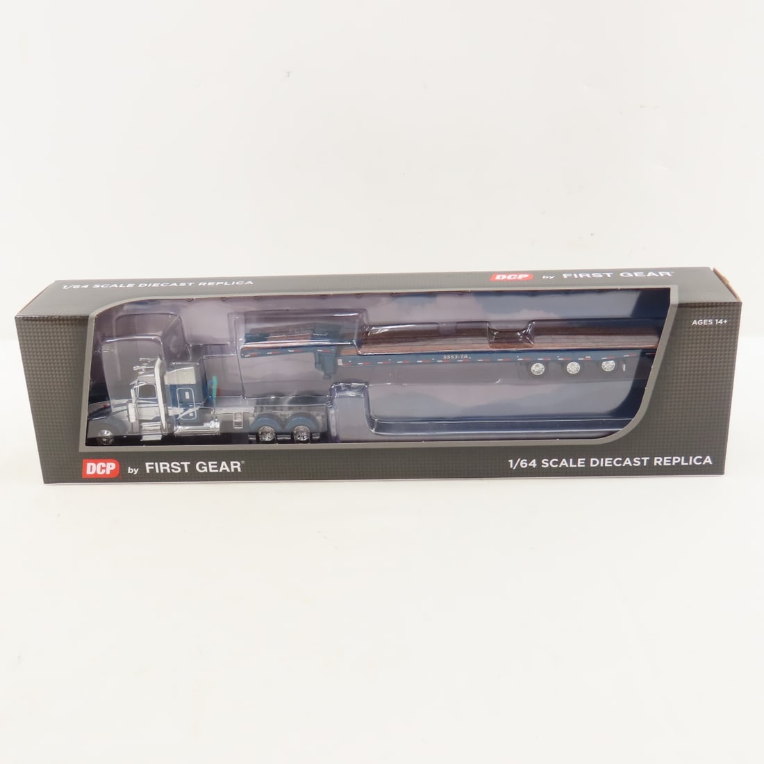 DCP First Gear 1:64 Scale Peterbilt 389 Sleeper: DCP First Gear 1:64 Scale Peterbilt 389 Sleeper - Rich Blue/Silver 60-1935 1/64 Scale Peterbilt Model 389 w/48" Mid Roof Sleeper & Talbert 5553TA Tri-Axle Trailer. Lot Size: 16x4x3" 1 lb All