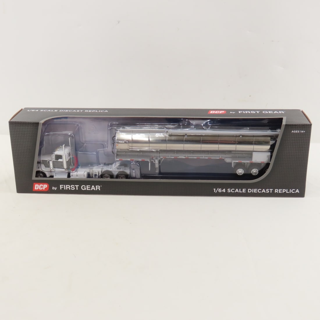 DCP First Gear 1:64 Scale Kenworth W900L Day Cab: DCP First Gear 1:64 Scale Kenworth W900L Day Cab - White/Black/Gray 60-1684 1/64 Scale Kenworth W900L Day Cab & Walinga Bulk Tank Tri-Axle Trailer. Lot Size: 16x4x3" 1 lb All information and photos