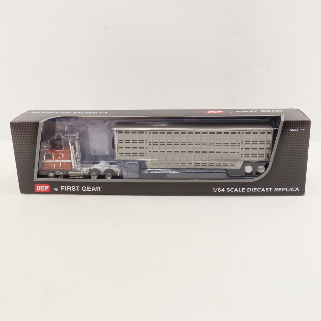 DCP First Gear 1:64 Scale Kenworth K100 Flattop: DCP First Gear 1:64 Scale Kenworth K100 Flattop - Brown/Silver 60-1814 1/64 Scale Kenworth K100 COE Flattop & Wilson 45' Vintage Livestock Trailer. Lot Size: 16x4x3" 1 lb All information and photos ar