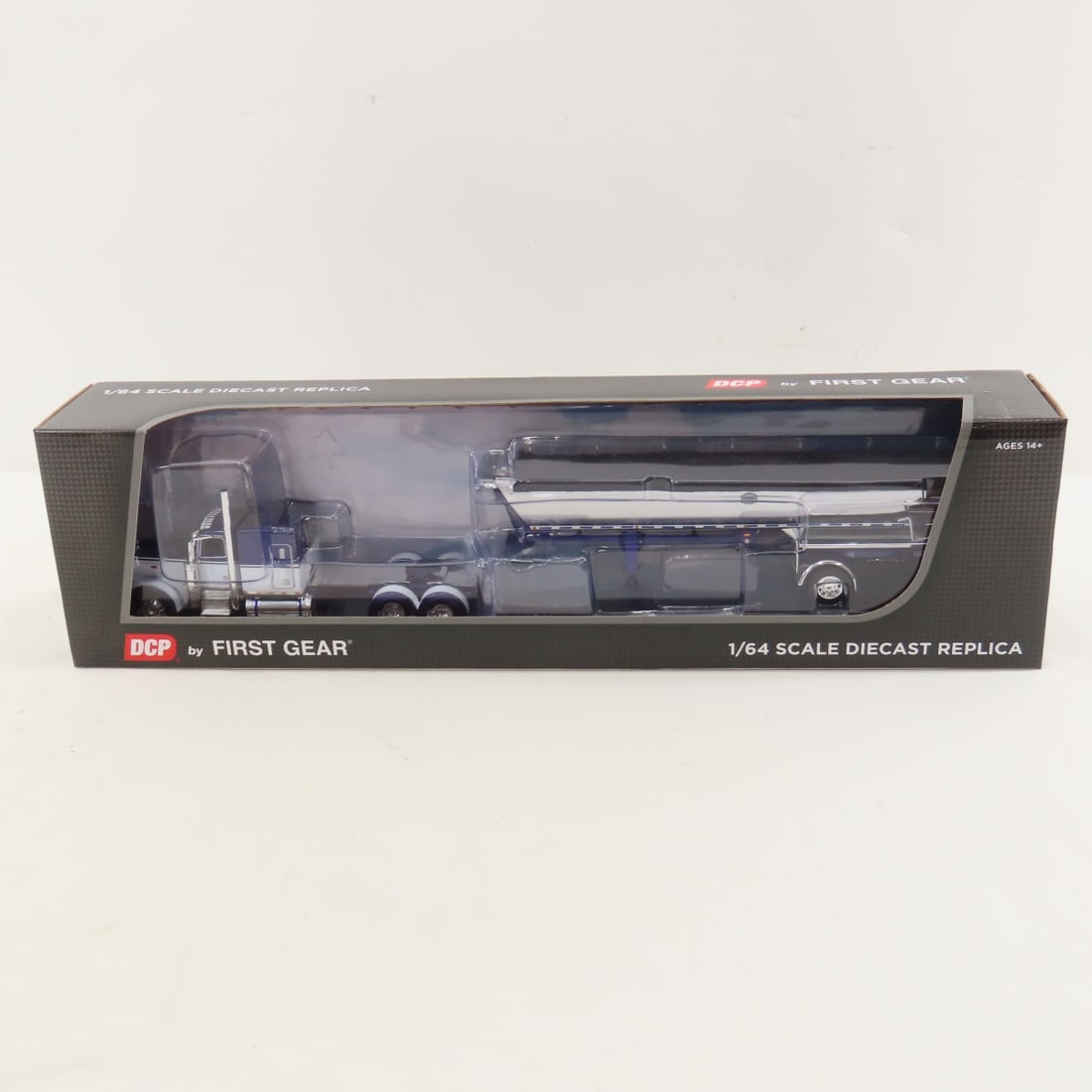 DCP First Gear 1:64 Peterbilt w/MAC Dump Trailer: DCP First Gear 1:64 Peterbilt w/MAC Dump Trailer - FT4Y Purple/Chrome 60-1694 1/64 Peterbilt Model 389 with 63" Flattop Sleeper & MAC Spread Axle Half Round Dump Trailer. Lot Size: 16x4x3" 1 lb All in