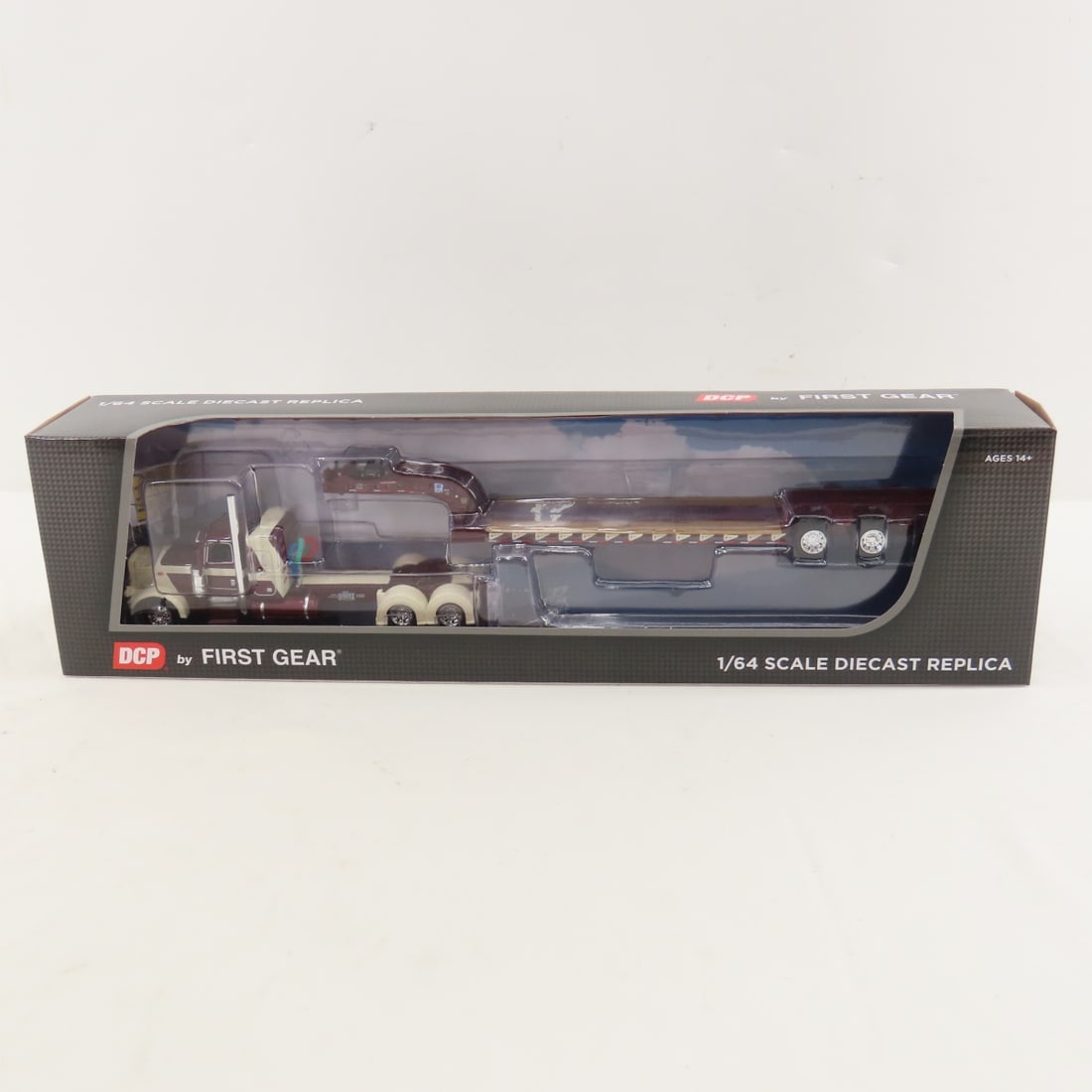 DCP First Gear 1:64 Peterbilt 389 w/Lowboy Trailer: DCP First Gear 1:64 Peterbilt 389 w/Lowboy Trailer - R.L. Spartz Trucking 60-1697 1/64 Scale Peterbilt Model 389 with 36" Flattop Sleeper & Fontaine Magnitude Lowboy Trailer. Lot Size: 16x4x3" 1 lb
