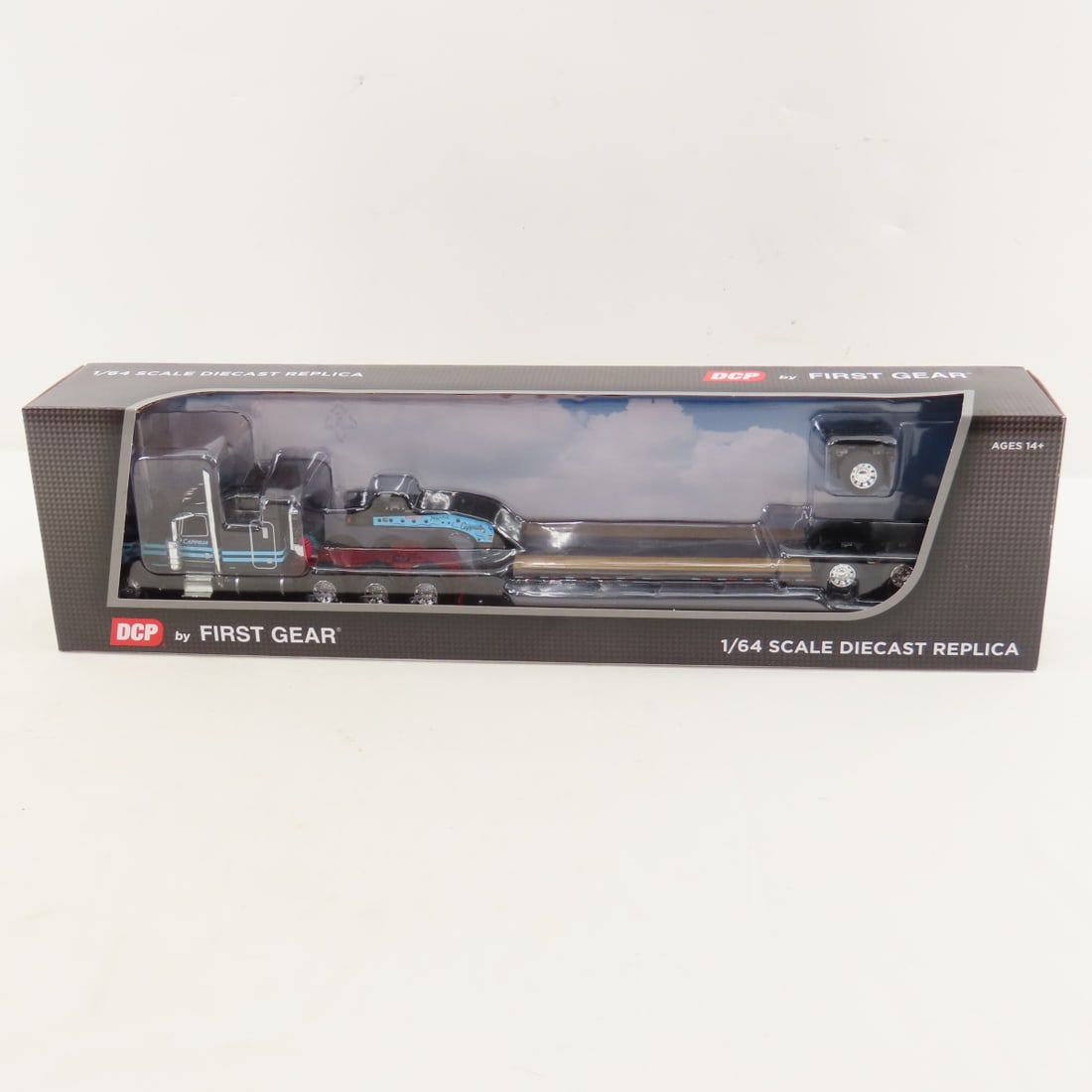 DCP First Gear 1:64 Peterbilt 389 w/Lowboy Trailer: DCP First Gear 1:64 Peterbilt 389 w/Lowboy Trailer - Capello Heavy Transport 60-1842 1/64 Scale Peterbilt Model 389 w/63' Mid Roof Sleeper & Fontaine Magnitude Low Boy Trailer w/Flip Axle. Lot Size: