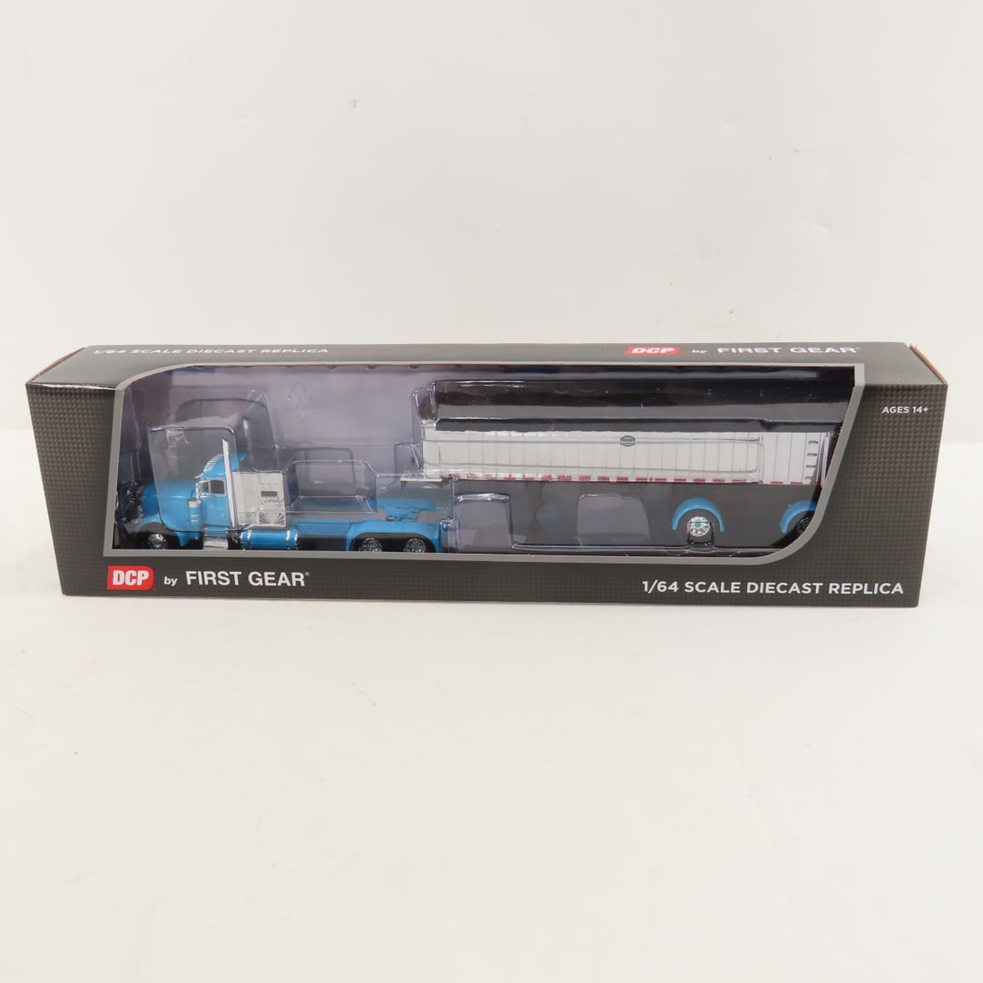 DCP First Gear 1:64 Scale Peterbilt 379 Sleeper: DCP First Gear 1:64 Scale Peterbilt 379 Sleeper - Cyan/Chrome 60-1893 1/64 Scale Peterbilt Model 379 w/60" Vintage Sleeper & MAC Coal Dump Frameless Spread Axle Trailer. Lot Size: 16x4x3" 1 lb All