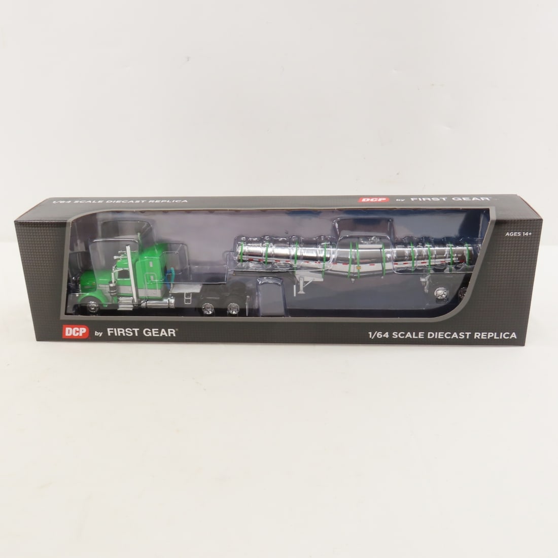 DCP First Gear 1:64 Peterbilt 389 Sleeper/Trailer: DCP First Gear 1:64 Peterbilt 389 Sleeper/Trailer - Green/Silver/Black 1/64 Scale Peterbilt Model 389 w/48" Mid Roof Sleeper & Polar Deep Drop Trailer. Lot Size: 16x4x3" 1 lb All information and photo