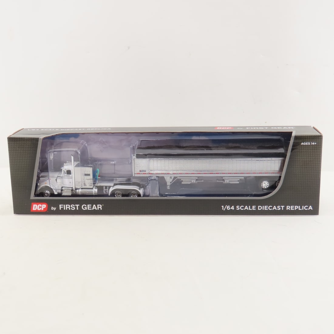 DCP First Gear 1:64 Scale Peterbilt 359 w/Sleeper: DCP First Gear 1:64 Scale Peterbilt 359 w/Sleeper - White/Chrome 60-1908 1/64 Scale Peterbilt Model 359 w/Vintage Sleeper & Wilson 43' High Side Grain Trailer. Lot Size: 16x4x3" 1 lb All information a