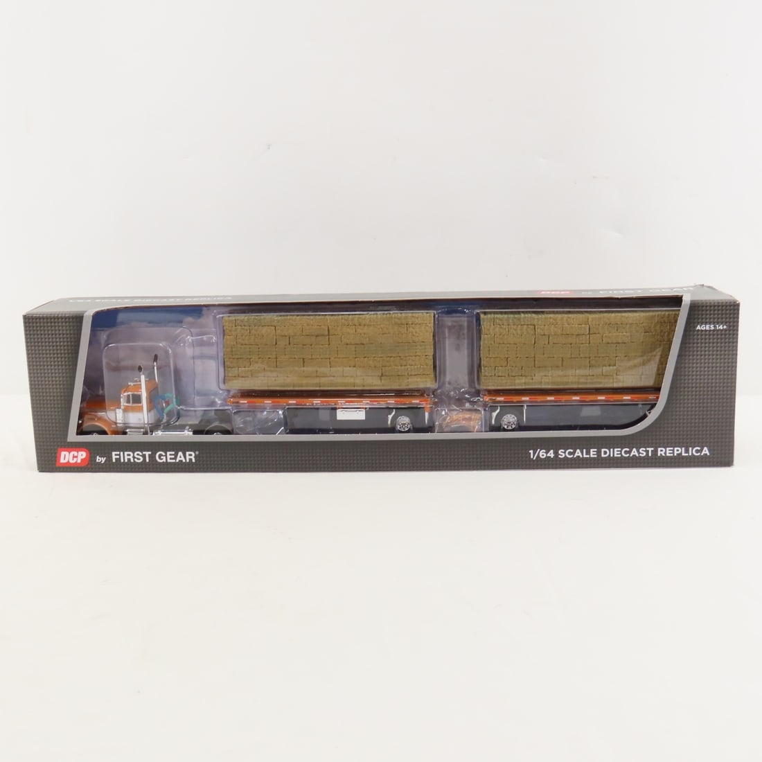 DCP First Gear 1:64 Peterbilt 379 Day Cab: DCP First Gear 1:64 Peterbilt 379 Day Cab - DC Orange/Silver 60-1888 1/64 Scale Peterbilt 379 Single Axle Day Cab and Utility Dual 28.5' Flatbed trailers with Hay Load. Lot Size: 17x4x3" 1 lb All info