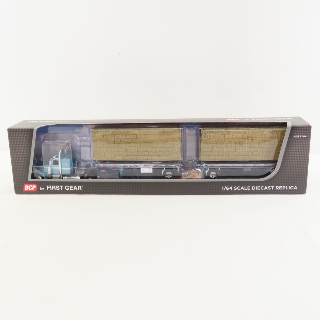 DCP First Gear 1:64 Scale Peterbilt 389 Sleeper: DCP First Gear 1:64 Scale Peterbilt 389 Sleeper - Pacific Blue 60-1831 1/64 Scale Peterbilt 389 Single Axle 36" Flat Top Sleeper and Utility Dual 28.5' Flatbed Trailers with Hay Load. Lot Size: