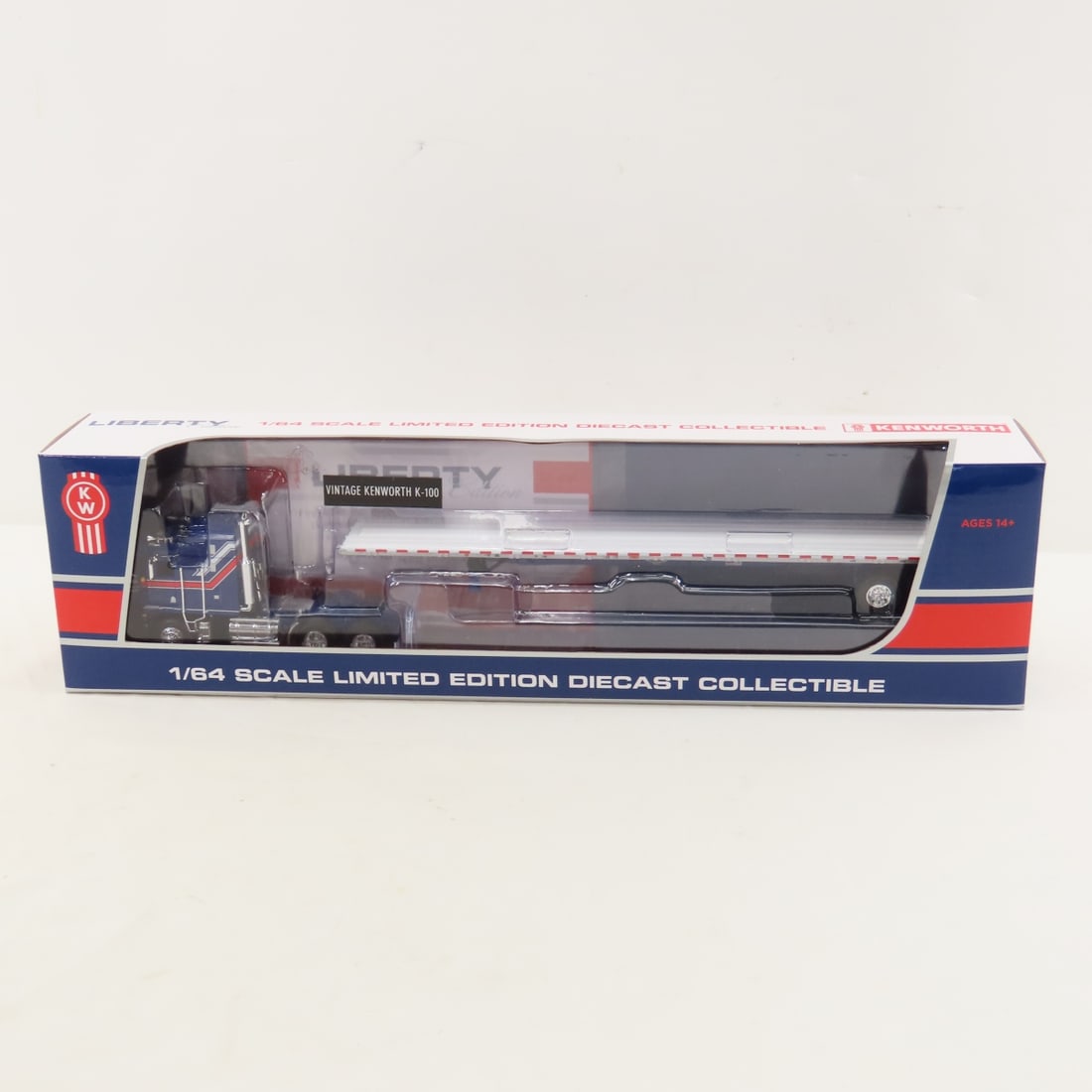 DCP Exclusive 1:64 Kenworth K100 COE Sleeper: DCP Exclusive 1:64 Kenworth K100 COE Sleeper - Liberty 69-1657 1/64 Kenworth K100 COE Aerodyne Sleeper and Wilson Flatbed Trailer. Lot Size: 16x4x3" 1 lb All information and photos are intended to be