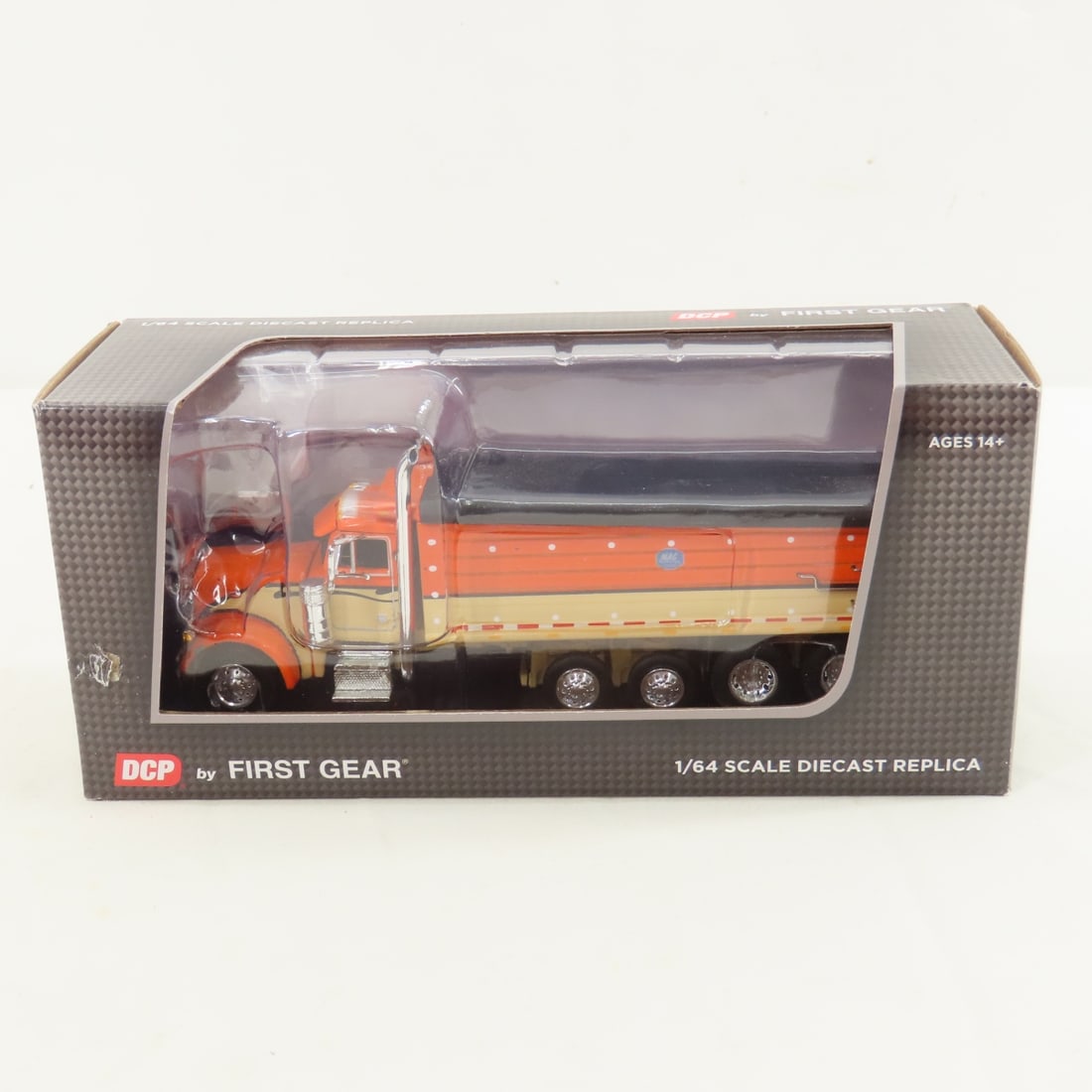 DCP First Gear 1:64 Peterbilt 379 w/MAC Dump Body: DCP First Gear 1:64 Peterbilt 379 w/MAC Dump Body - CWT Orange/Black/Tan 60-1348 1/64 Scale Peterbilt 379 with MAC Dump Body Quad-Axle. Lot Size: 8x4x3" 1 lb All information and photos are intended