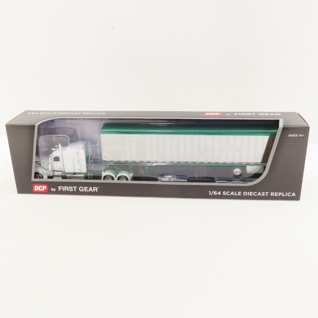 DCP First Gear 1:64 Peterbilt 389 Sleeper/Trailer: DCP First Gear 1:64 Peterbilt 389 Sleeper/Trailer - White/Green 60-2192 1/64 Scale Peterbilt 389 63" Mid Roof Sleeper with Utility 53' Smooth Sided Dry Goods Spread Axle Trailer. Lot Size: 16x4x3" 1 l