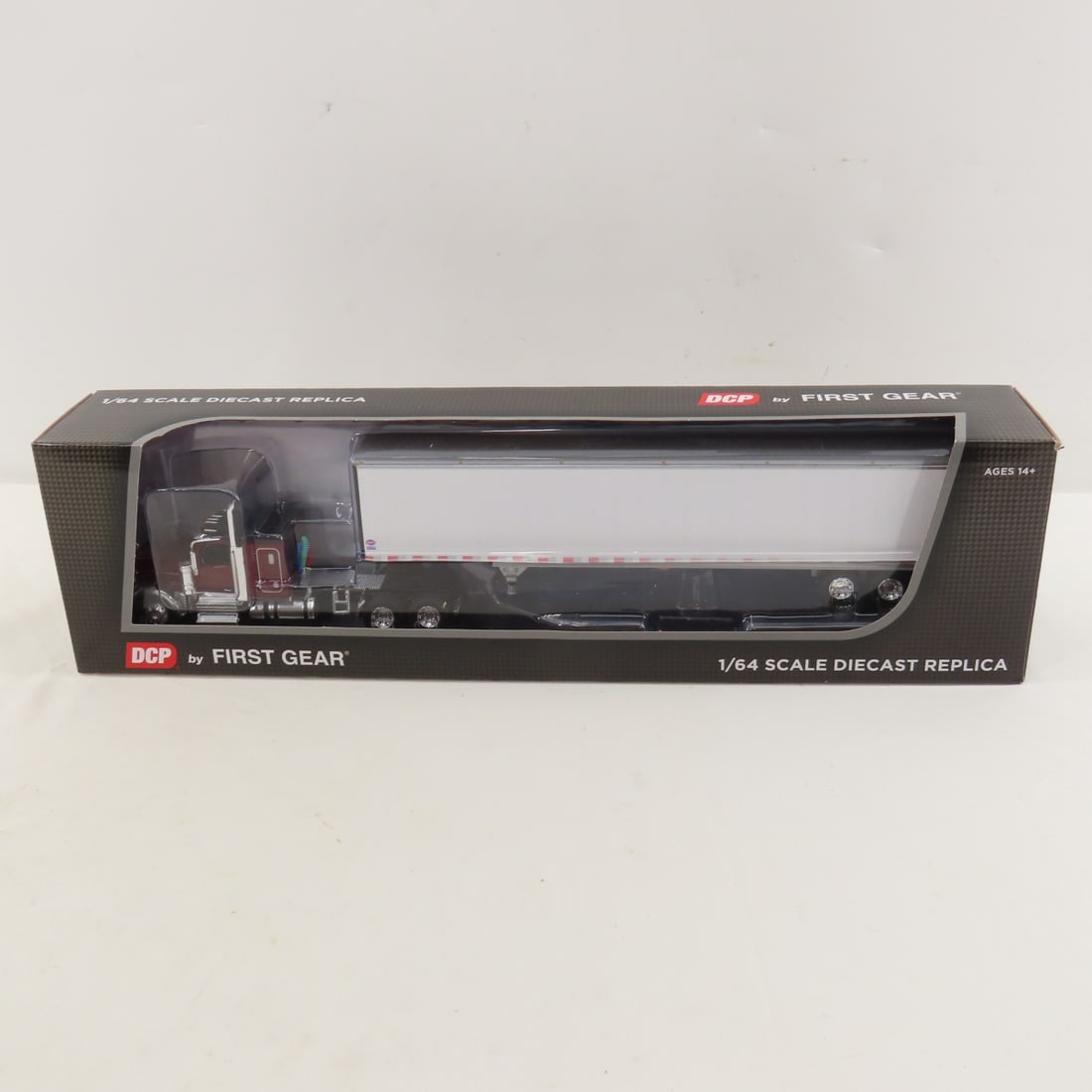 DCP First Gear 1:64 Peterbilt 589 Sleeper/Trailer: DCP First Gear 1:64 Peterbilt 589 Sleeper/Trailer - Legendary Red 60-2171 1/64 Scale Peterbilt Model 589 w/58" Flattop Sleeper & Utility 4000D-X Composite Smooth Sided Dry Goods Trailer. Lot Size: