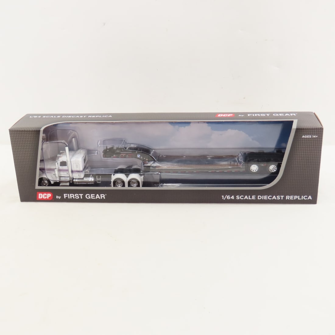 DCP First Gear 1:64 Peterbilt 389 & Lowboy Trailer: DCP First Gear 1:64 Peterbilt 389 & Lowboy Trailer - White/Black 60-2191 1/64 Scale Peterbilt 389 36" Flattop Sleeper with Fontain Magnitude Tri-Axle Lowboy Trailer. Lot Size: 16x4x3" 1 lb All