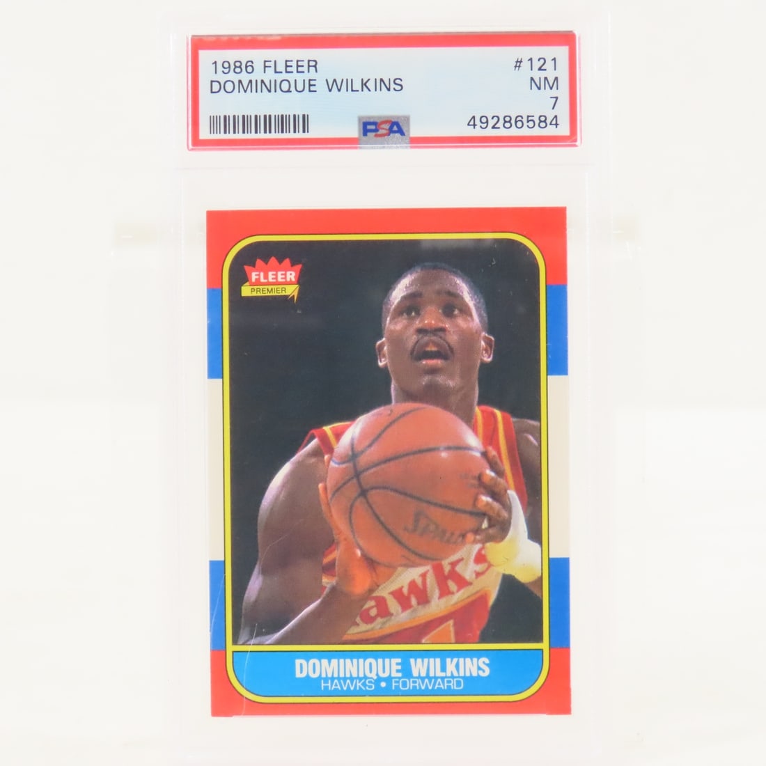 1986 Fleer Dominique Wilkins #121 PSA 7 NM: 1986 Fleer Dominique Wilkins #121 PSA 7 NM - Lot Size 5.5x3.5x.5" 1 LB All information and photos are intended to be as accurate as possible, but errors are possible. No item may be returned or
